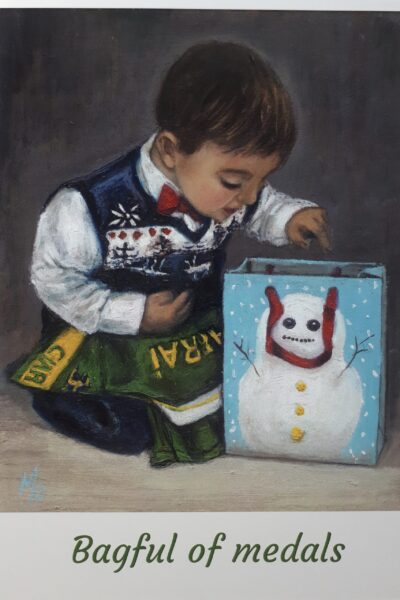 Little boy Kerry jersey looking into a Christmas bag
