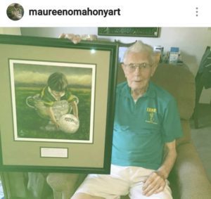 Man holding image little boy Kerry GAA