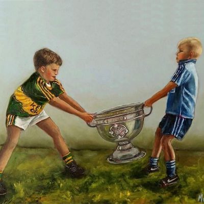 Two boys Dublin and Kerry fighting over the Sam Maguire