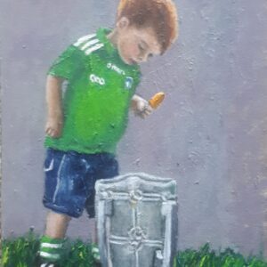 a little boy looking into liam mc carthy cup