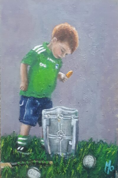 a little boy looking into liam mc carthy cup