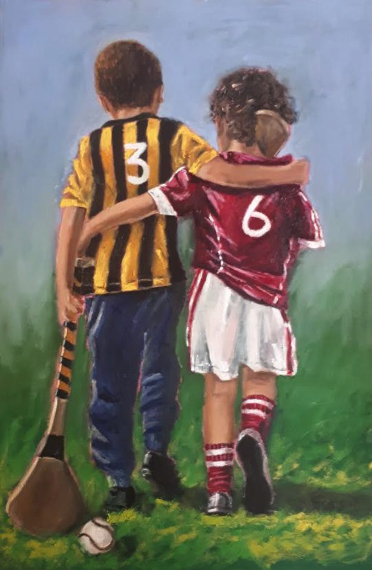 Two boys arms around each other GAA jerseys walking home after hurling match