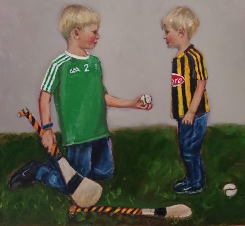 Master Class Hurling To The Core,.Limerick hurler giving a solitary to a younger Kilkenny boy