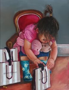 Little girl looking into a Brown Thomas bag